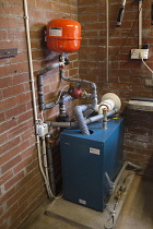 Housing, Homes, Oli fired central heating boiler situated in garage.