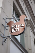 Ireland, North, Belfast, Cathedral Quarter, Exterior sign for the Potted Hen restaurant in St Annes Square.