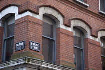 Ireland, North, Belfast, Cathedral Quarter, Signs on building on the corner of Skipper and Waring street.