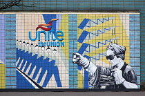 Ireland, North, Belfast, Colourful mural depicting Unite Union workers on the exterior of the TGWU building on the corner of Donegall and High Street.