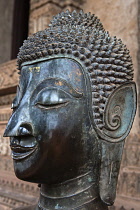 Laos, Vientiane, Haw Pha Kaeo, Head of a Buddha statue.