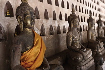 Laos, Vientiane, Wat Si Saket, Seated Buddhas and small Buddhas in niches.