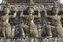 Thailand, Bangkok, Wat Arun, Ramayama demons and fragments of Chinese porcelain encrusting the sides of the Temple of the Dawn.