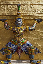 Thailand, Bangkok, Grand Palace, Demon from the Ramayama on gold stupa.