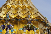 Thailand, Bangkok, Grand Palace, Demons from the Ramayama on gold stupa.