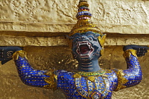 Thailand, Bangkok, Grand Palace, Demon from the Ramayama on gold stupa.