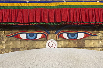 Nepal, Kathmandu, Close-up of pair of eyes and 'nose' on one of the faces of the Great Stupa's steeple; the nose is, in fact, the Nepali number 1.
