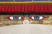 Nepal, Kathmandu, Close-up of pair of eyes and 'nose' on one of the faces of the Great Stupa's steeple; the nose is, in fact, the Nepali number 1.