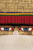 Nepal, Kathmandu, Close-up of a pair of eyes and 'nose' on the steeple of the Great Stupa. The nose is the Nepali symbol for the number one.