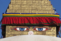 Nepal, Kathmandu, Close-up of pair of eyes and 'nose' on one of the faces of the Great Stupa's steeple; the nose is, in fact, the Nepali number 1.