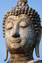Thailand, Sukothai, Close up of cracked face of a white Buddha, Wat Trapang Ngoen.