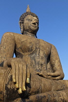Thailand, Sukothai, Seated Buddha with gold-painted fingernails on right hand, Wat Mahathat Royal Temple.