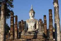 Thailand, Sukothai, White, seated Buddha between two rows of pillars,  Wat Mahathat Royal Temple.
