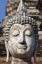 Thailand, Sukothai, Close up of cracked, white head of a Buddha, Wat Trapang Ngoen.