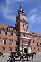 Poland, Warsaw, Old Town, Plac Zamkowy, Arkady Kubickiego, Red Brick Royal Castle with tourist horse and carriage in the foreground.