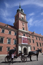 Poland, Warsaw, Old Town, Plac Zamkowy, Arkady Kubickiego, Red Brick Royal Castle with tourist horse and carriage in the foreground.