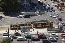 Poland, Warsaw, Centrum, Busy roundabout with cars and trams.