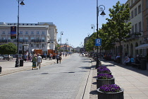 Poland, Warsaw, Old Town, Krakowskie Przedmiescie with tourists walking along.