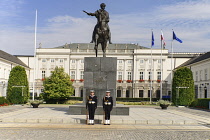 Poland, Warsaw, Poland, Warsaw, Ul Krakowskie Przedmiescie or The Royal Way, Radziwill Palace, Presidential Residence with a statue of Prince Józef Poniatowski and 2 guards in front.