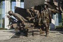 Poland, Warsaw, Monument to the Warsaw Uprising, another section of the monument showing a group of Polish insurgents actively engaged in combat.