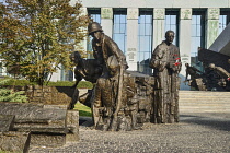 Poland, Warsaw, Monument to the Warsaw Uprising, A section known as Exodus depicting a Polish soldier entering the sewers overseen by other soldiers and a priest.