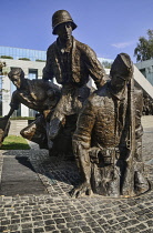 Poland, Warsaw, Monument to the Warsaw Uprising, A section known as Exodus depicting a Polish soldier entering the sewers overseen by other soldiers.