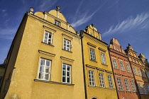 Poland, Warsaw, Canon Square with some of its colourful facades.