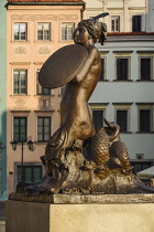 Poland, Warsaw, Stare Miasto or Old Town Square, West side of the square with close up of the statue of Syrenka or The Mermaid of Warsaw in the centre.