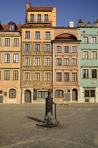 Poland, Warsaw, Stare Miasto or Old Town Square, West side of the square with 19th century iron water pump.