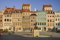 Poland, Warsaw, Stare Miasto or Old Town Square, West side of the square with statue of Syrenka or The Mermaid of Warsaw in the centre.