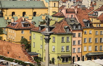 Poland, Warsaw, Castle Square, King Sigismund III Vasa Column with colourful roofscapes behind seen from St Anne's Church Viewing Tower.