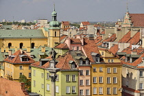 Poland, Warsaw, Castle Square, King Sigismund III Vasa Column with colourful roofscapes behind seen from St Anne's Church Viewing Tower.
