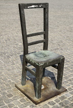 Poland, Krakow, Podgorze area, Plac Bohaterow Getta or Ghetto Heroes Square formerly known as Plac Zgody, Memorial to Jews from the Kraków Ghetto on their deportation site, Each steel chair represent...