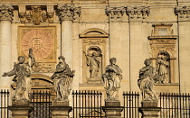 Poland, Krakow, Church of Saints Peter and Paul with statues of the Apostles in the foreground.