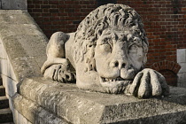 Poland, Krakow, Rynek Glowny or Main Market Square, Wieza Ratuszowa or Town Hall Tower, Stone lion at entrance.