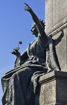 Poland, Krakow, Rynek Glowny or Main Market Square, Allegorical figure of the Motherland on the pedestal of the Adam Mickiewicz Statue.