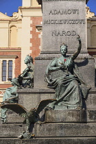 Poland, Krakow, Rynek Glowny or Main Market Square, Allegorical figure of the Motherland on the pedestal of the Adam Mickiewicz Statue.