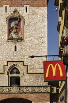 Poland, Krakow, St Florian's Gate leading into the Old Town, section of the gate with McDonalds sign.