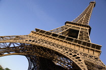 France, Ile de France, Paris. Angled view looking up at The Eiffel Tower.