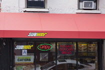 USA, New York State, New York City, Manhattan, Exterior of fast food sandwich store with neon sign. **Editorial Use Only**