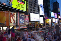 USA, New York State, New York City, Manhattan, Crowds of tourists in illuminated Times Square at night.