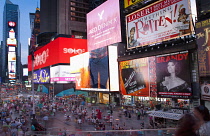 USA, New York State, New York City, Manhattan, Crowds of tourists in illuminated Times Square at night.