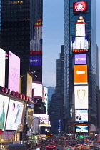 USA, New York State, New York City, Manhattan, Crowds of tourists in illuminated Times Square at night.