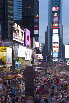 USA, New York State, New York City, Manhattan, Crowds of tourists in illuminated Times Square at night.