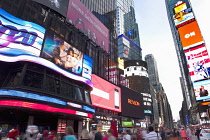 USA, New York State, New York City, Manhattan, Crowds of tourists in illuminated Times Square at night.