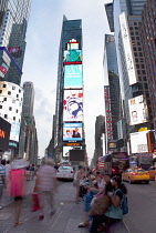 USA, New York State, New York City, Manhattan, Crowds of tourists in illuminated Times Square at night.