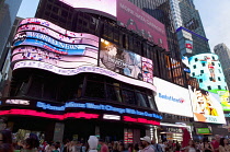 USA, New York State, New York City, Manhattan, Crowds of tourists in illuminated Times Square at night.