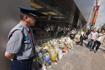 Ginza, Flowers and tributes left outside the Apple Store on Chuo-dori Avenue after Steve Jobs death.