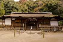 Japan, Kyoto, Uji, Ujigami Jinja shrine built about 1060 a Unesco World Heritage Site and a Japanese designated national treasure,  this the Haidan, hall of worship with two cones of purifying sand in...