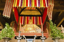 Japan, Kyoto, Uji, Manpuku-ji temple,  built about 1661, in Chinese Ming style, statue of god Hotei  in the Tenno-den.